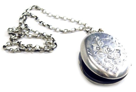 A silver oval locket pendant and chain, the locket with engraved floral design, 4.5cm high, on a silver belcher chain, 50cm long, 27.9g.