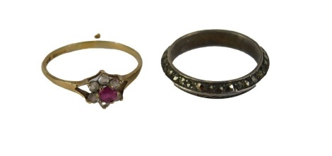 A ladies floral set dress ring, marked 375 on plain shank, size R, 1.2g, and a further dress ring. (2) Auctioneer Announce no bangle in lot.