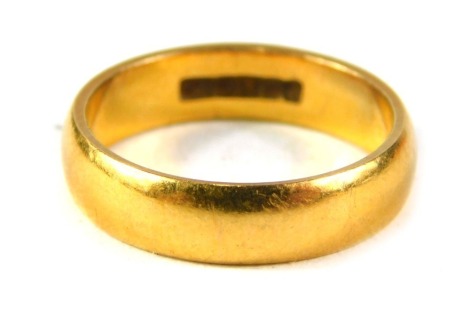 A 22ct gold wedding band, of plain design, ring size K, 4.8g.