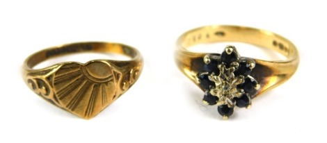 Two dress rings, comprising a 9ct gold sapphire cluster, and a 9ct gold signet ring, with central heart panel, 5.2g all in. (2)