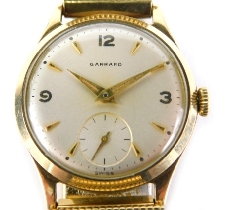 A Garrard 9ct gold cased gentleman's wristwatch, with silvered numeric dial, gold hands and seconds dial, inscribed presented to GA Hopkinson by the Directors of De Havilland Engine Company Limited for 20 Years Service 1939-1959, on plated bracelet, the d