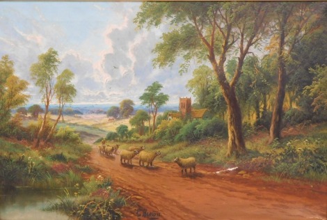 E. Heaton (19thC). Sheep on a path before church, oil on canvas, signed, 50cm x 79cm.