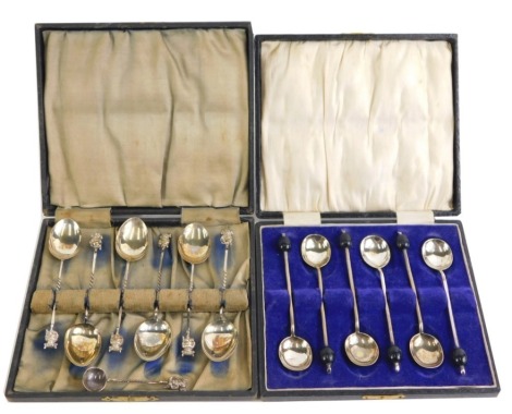 A cased set of six George VI silver Lincoln Imp teaspoons, each with Lincoln Imp top, on twist stem and shaped bowl, maker TEH, Birmingham 1945, with additional preserve spoon, 1.21oz, boxed, and a cased set of six silver plated coffee bean spoons.