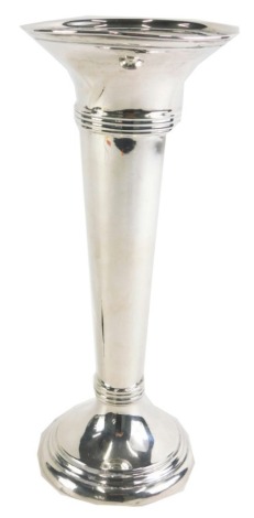 A George V silver stem vase, with a fluted rim and a three ringed collar, on a stepped foot with weighted base, London 1918, 26cm high, 12.71oz gross.