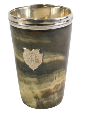 A Victorian horn beaker, with a silvered rim and lining, with a crest bearing initials JMK, London hallmarks rubbed, circa 1860/1870, 13cm high.