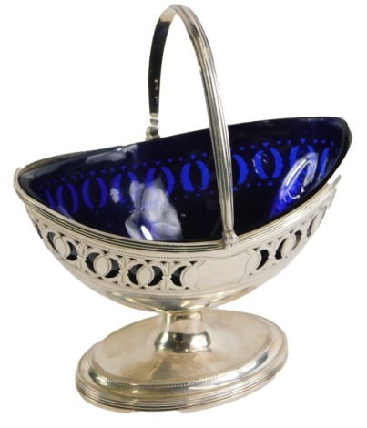 A George III silver sugar basket, with swing handle and pierced design body, with vacant cartouche, on a stepped foot, maker HC, London 1791, 4.96oz.