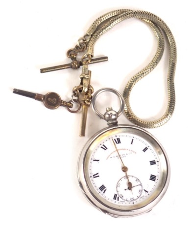 An Improved Greenwich Lever silver cased pocket watch, with white enamel dial and Roman numeric border, with seconds dial and gold hands, inscribed WE Watts and Co of Derby, with import marks, keywind and a plated chain.