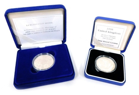 A sterling silver proof celebration medal to commemorate The Marriage of HRH Prince of Wales and Mrs Camilla Parker-Bowles coin, in outer box with paperwork and a 1998 silver proof crown, His Royal Highness the Prince of Wales 50th Birthday. (2, cased)