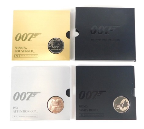 A 007 James Bond coin collection, enclosing the Bond James Bond Shaken not Stirred and Pay Attention 007 five pound uncirculated coin, in presentation pack.