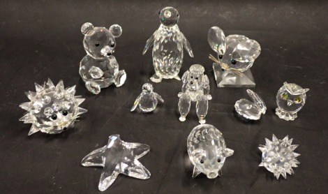 A collection of Swarovski crystal and other ornaments, to include pig, starfish, oyster clam, poodle, penguins, bears, etc. (a quantity)