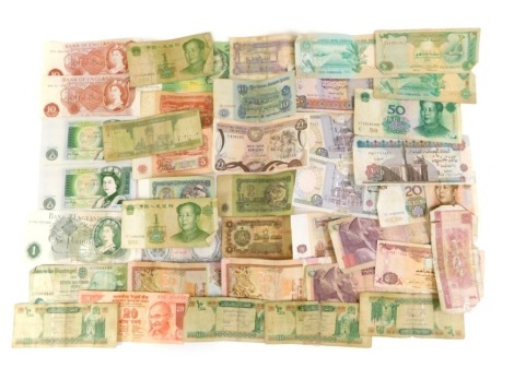 A collection of banknotes, to include Bank of England ten shilling notes, one pound notes, Indian banknotes, middle east and others. (a quantity)