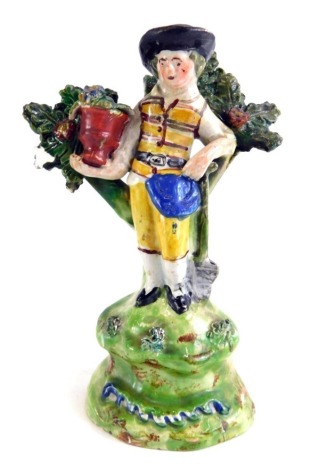 A late 18thC or early 19thC Walton Staffordshire bocage figure, modelled as a gardner, (AF) 15cm high.