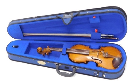 A Chinese Blessing two piece back violin, with unmarked bow in soft shell case.