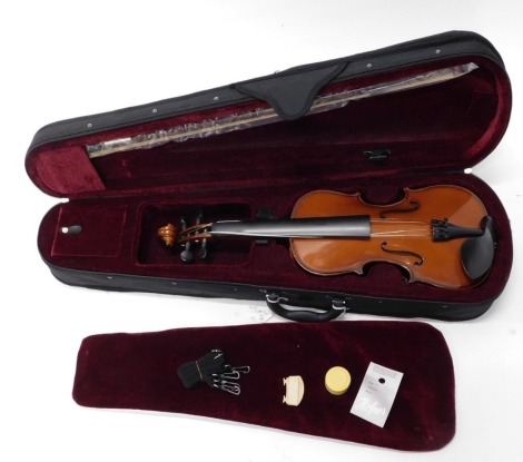 An Alfred Stingl by Hofner two piece split back violin, bearing label, 58cm long, in soft shell case.