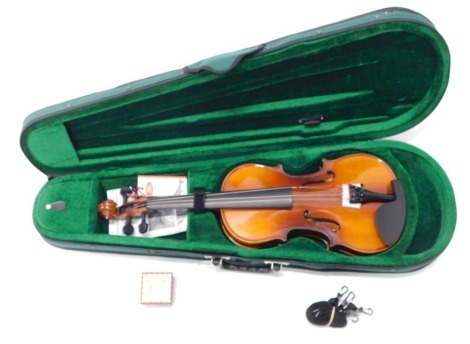 An Antoni Debut two piece back violin, bearing label in soft shell case, 52cm long.