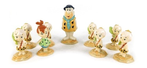 A collection of John Beswick Flintstone figures, comprising seven Bamm Bamm Rubble figures, Fred Flintstone, and Pebbles Flintstone. (9, boxed)