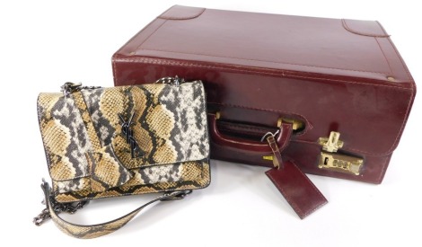 A maroon leather briefcase and a imitation animal skin bag, stamped WSL.