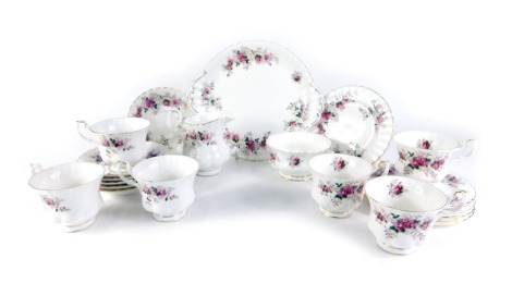 A Royal Albert Lavender Rose pattern part tea service, comprising milk jug, sugar bowl, cake plate, six cups and saucers, and six side plates.