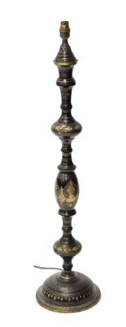 An Eastern metal lamp, of baluster form with etched gilding, 90cm high.