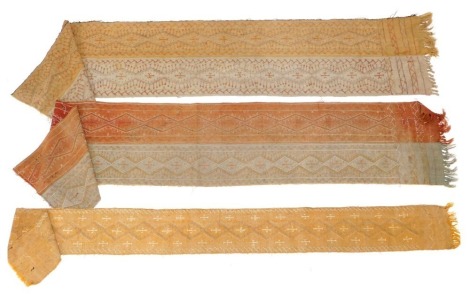 Three similar 19thC North African tent hangings embroidered fragments, each with a Persian style design of lozenges, etc., in orange and grey.