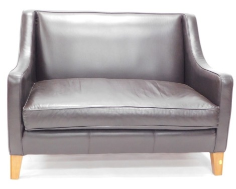 A Multi York black leather two seater sofa.