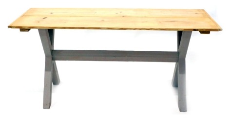 A pine kitchen table, with two panelled top, on X frame painted base, 77cm high, 164cm wide, 62cm deep.