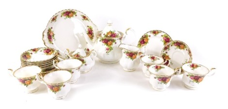 A Royal Albert Old Country Roses part tea service, comprising teapot, milk jug, sugar bowl, six cups and saucers, six side plates, and a cake plate.