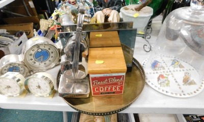 A pottery barn alarm clock, two baby Ben alarm clocks, brass serving tray, coffee pot, cheese dome and cover, chopping board, and a silver coloured violin ornament. (a quantity)