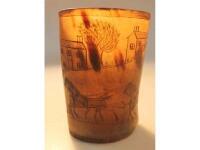 A 19thC horn beaker decorated with a coaching scene