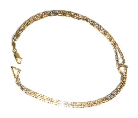 An 18ct gold fancy link neck chain, of bicolour design, with S shaped links, 50cm long, 9.4g.