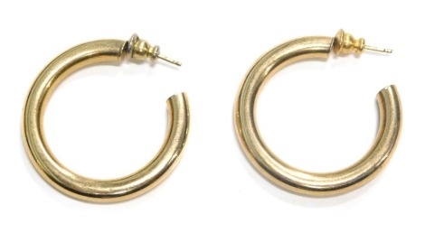 A pair of hoop earrings, each of plain design, 3cm wide, yellow metal with rubbed marks, 4g.