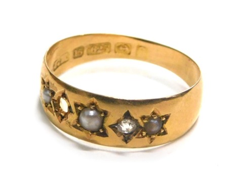 A 15ct gold Victorian gypsy ring, set with tiny diamonds and cultured pearls, one stone missing, ring size M½, 2g all in.