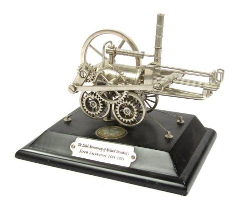 A 200th Anniversary of Richard Trevithick's Steam Locomotive model, £2 commemorative coin dated 1804-2004, on black cased plinth.