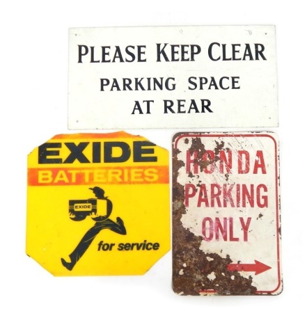 Three tin signs, comprising Honda Parking Only, on a white ground with red writing, 46cm x 31cm, an Exide Batteries yellow service sign, 42cm x 43cm, and a Keep Clear Parking Space At Rear metal sign, white ground, 31cm x 61cm. (AF) (3)