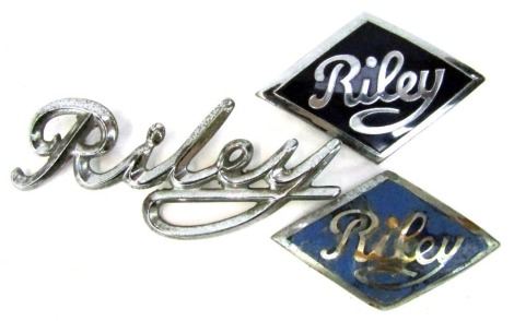 Three Riley car badges, comprising two Riley and enamel diamond shaped badges, 7cm wide, and a chrome example, 11cm wide. (3)