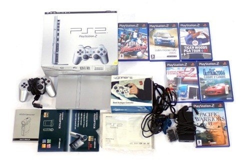 A Sony Playstation 2 slim, in silver, boxed, together with games including Tiger Woods PGA Tour 07, Colin Mcrae Rally 2005, Ford Racing 2, etc.