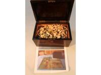 An early 20thC wooden jigsaw puzzle in rosewood veneered box