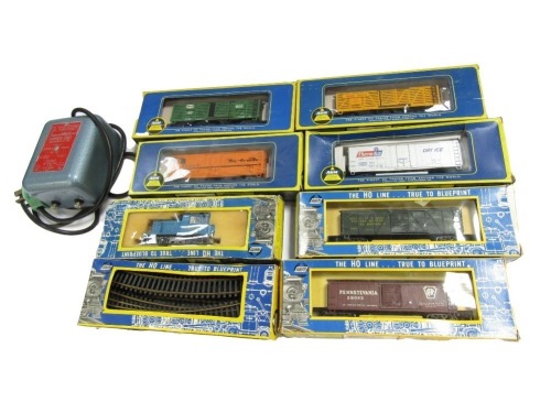 AHM Railway HO gauge rolling stock, blue loco and track, and a transformer, boxed. (9)