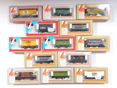 Lima Models OO gauge rolling stock, including R Whites Lemonade box van, Austin Rover seven plank wagon, Clarks seven plank wagon, brake van, BR brown livery, boxed. (13)