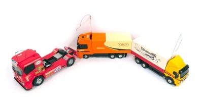 Remote control vehicles, including a Mercedes Benz Actros in TNT livery, Mercedes Benz 1838 Trans Cargo Jumbo, and Mercedes Benz Esso Tiger Racing Team truck. (3)