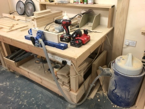 Workbench, drill, pocket hole jig, timber offcuts, extractor, etc. Note: VAT is payable on the hammer price of this lot at 20%.