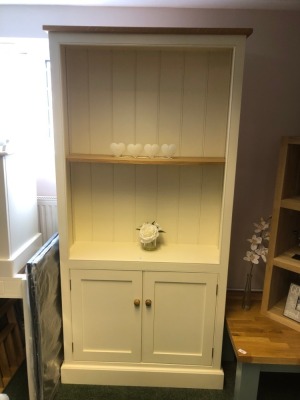 A cabinet bookcase. Note: VAT is payable on the hammer price of this lot at 20%.