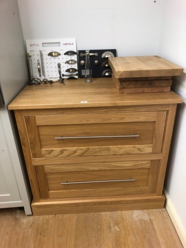 An oak two drawer chest. Note: VAT is payable on the hammer price of this lot at 20%.