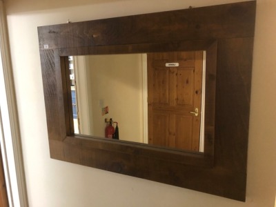 A rustic wall mirror. Note: VAT is payable on the hammer price of this lot at 20%.