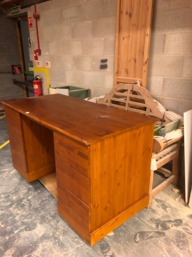 A pine twin pedestal desk, lutyen, garden bench, etc. Note: VAT is payable on the hammer price of this lot at 20%.