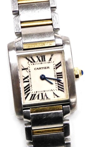 A Cartier gold plated and stainless steel Tank Francaise lady's wristwatch, rectangular dial bearing Roman numerals, blue cabochon set winder, the back numbered 508746CD/2384, boxed, with user guide and certificate & guarantee, date of purchase 2017, with