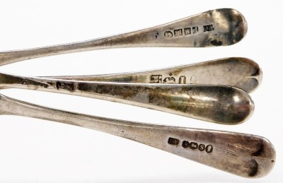 A pair of George V silver sugar tongs, Birmingham 1919, together with Georgian silver teaspoons, various hallmarks, 2.23oz. - 2