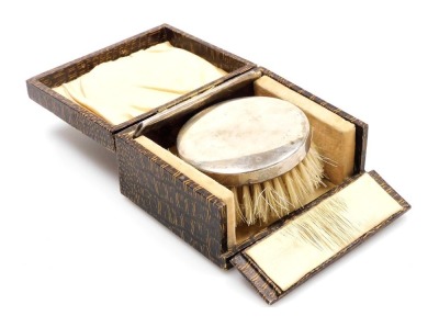 A George V silver backed hairbrush, and comb, boxed, Birmingham 1925.