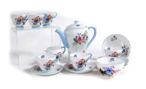 A Shelley porcelain Wild Flowers pattern part coffee service, pattern number 13668, comprising coffee pot, cream jug, sugar bowl, six demi tasse coffee cups and saucers.