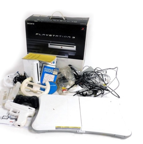 A Sony Playstation 3, Wii balance board, and further Wii accessories.